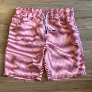 Coral & white striped maagmic swim trunks. Boy’s size 10/12